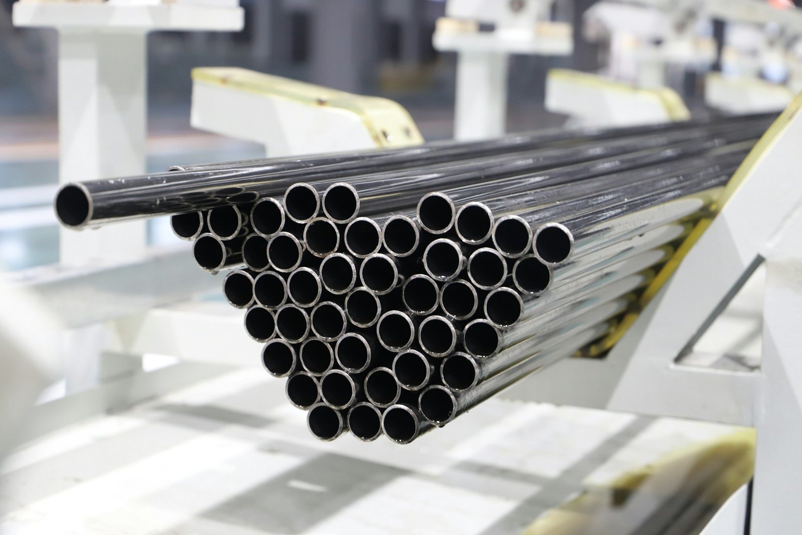 Real steel tubes stacked on a production line
