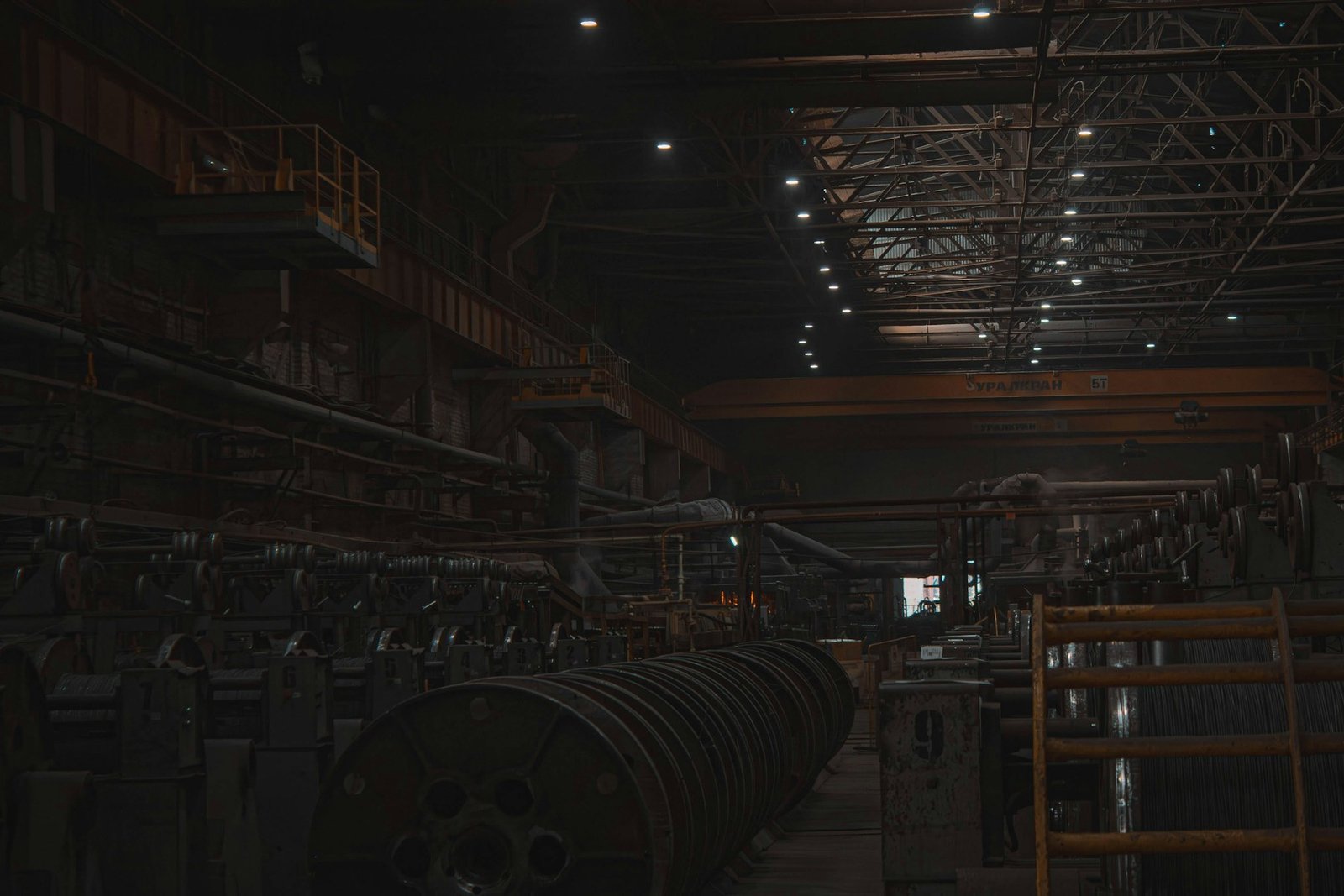 Real industrial warehouse with metal coils and handling equipment